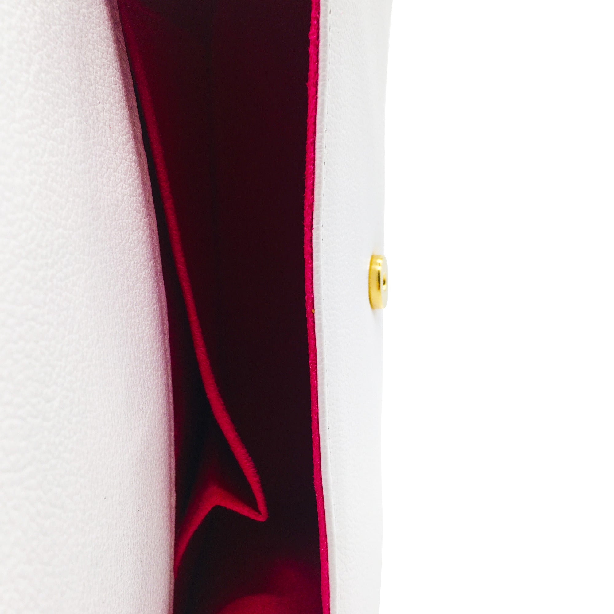 Showing the inside of the genuine soft white leather handbag. The interior is raspberry pink suede with a pocket.