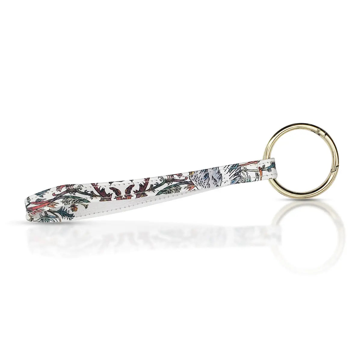 ring with a white leather handle with leaves and tree design