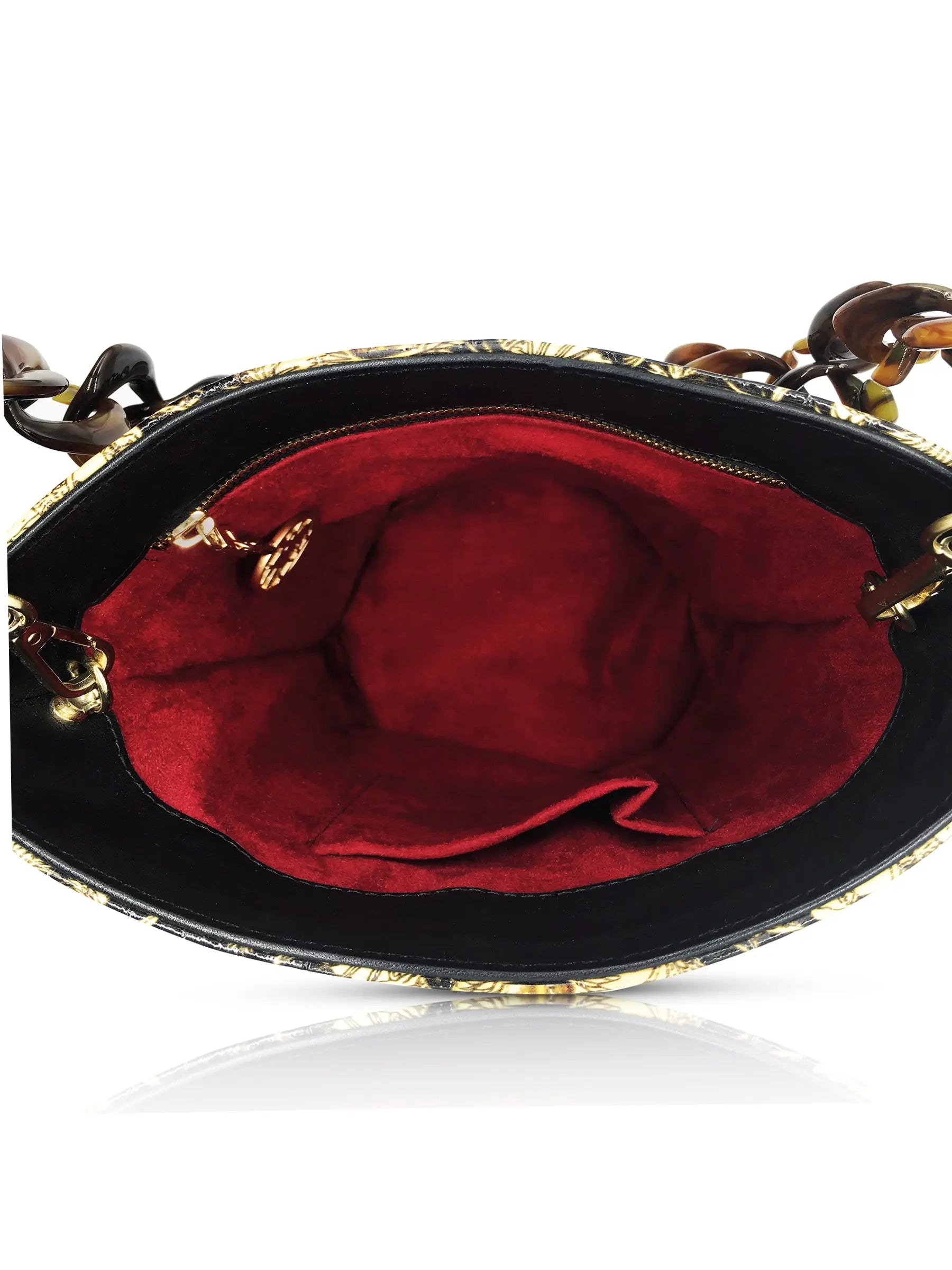 View of the interior of the bucket bag with genuine suede interior inside zipped pocket and patch pouch.