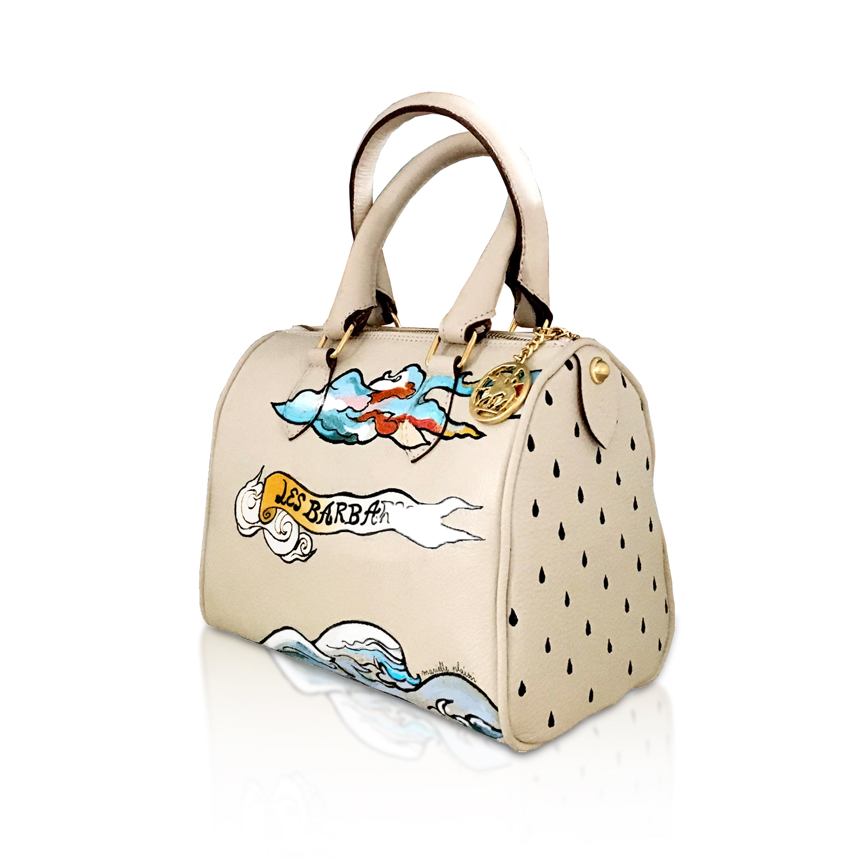 side view of Beige soft Italian leather mini handbag, with hand painted designs in blue, gold and white by artist Marielle Plaisir.