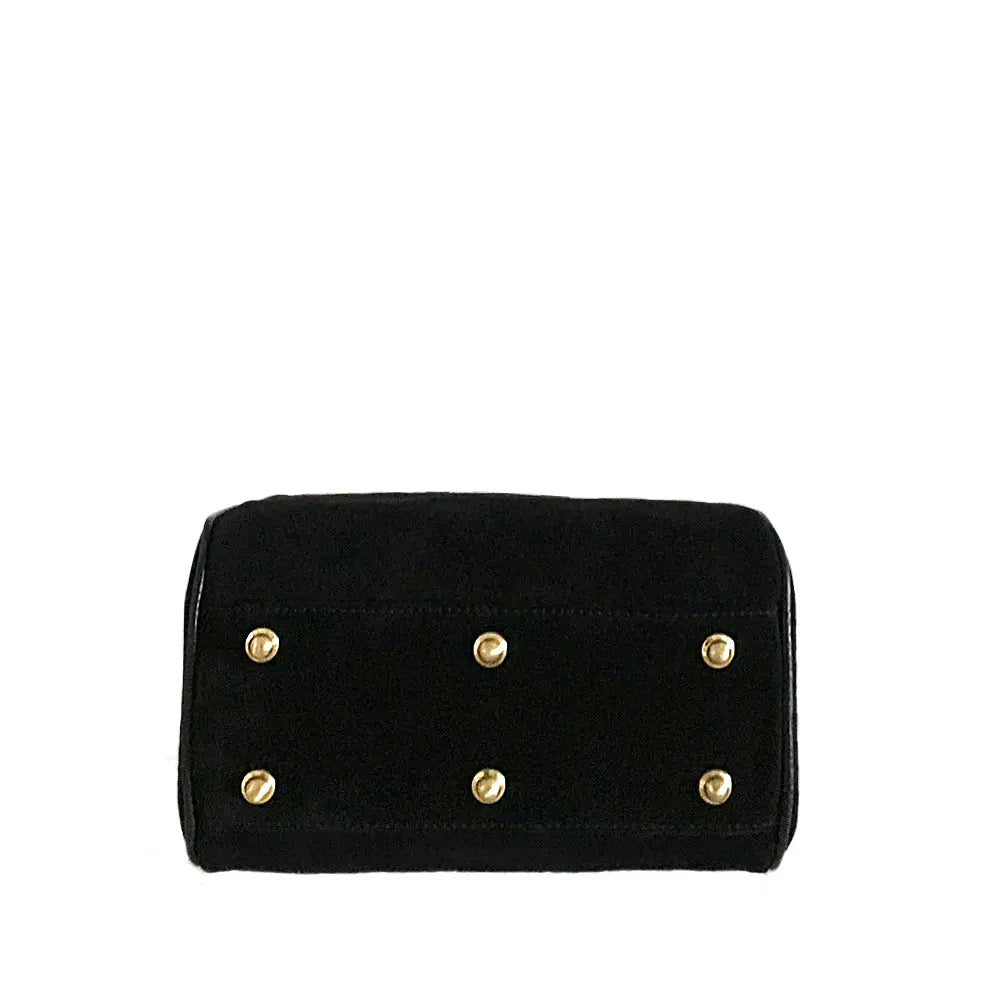 Showing the brass rivets on the bottom of the bag to protect the base